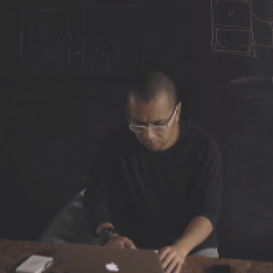 person typing on a laptop