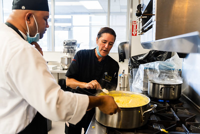 culinary teacher advising cooking techniques