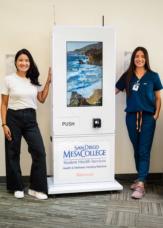 Dotstash founder and Mesa nurse stand with Wellness Vending Machine